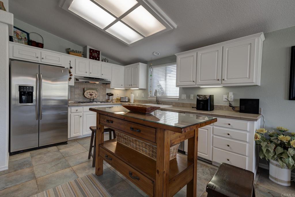 1010 Palm Canyon Drive, Unit 368 Borrego Springs, CA 92004 - Photo 2 of 23 a kitchen with granite countertop a sink appliances a counter space and cabinets