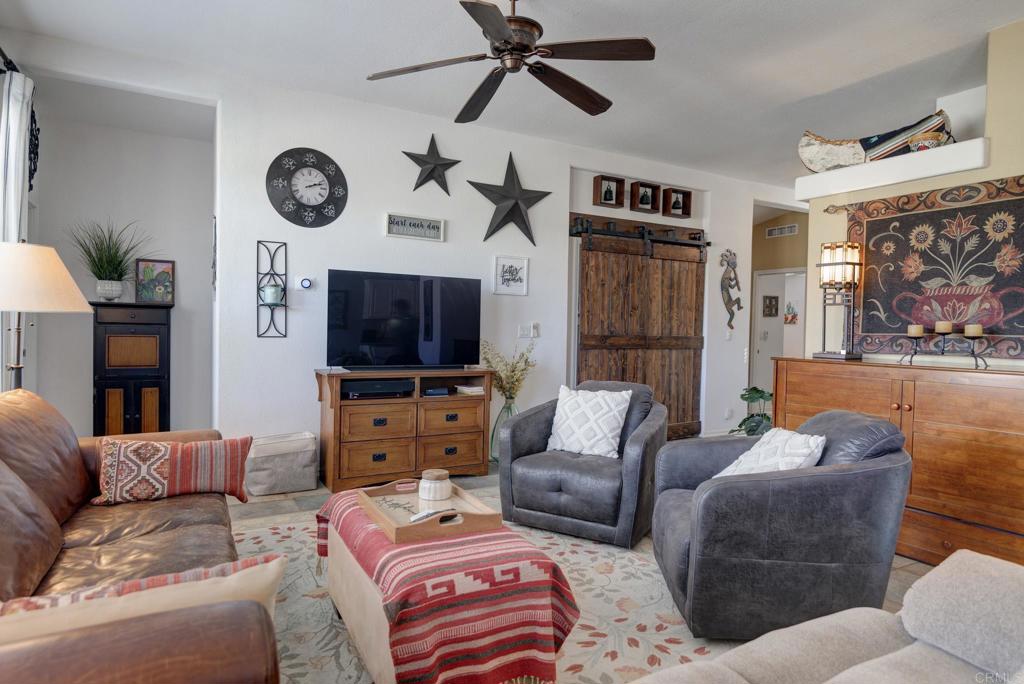 1010 Palm Canyon Drive, Unit 368 Borrego Springs, CA 92004 - Photo 5 of 23 a living room with furniture and a flat screen tv