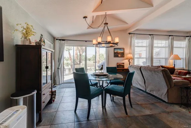 a view of a dining room with furniture window and outside view