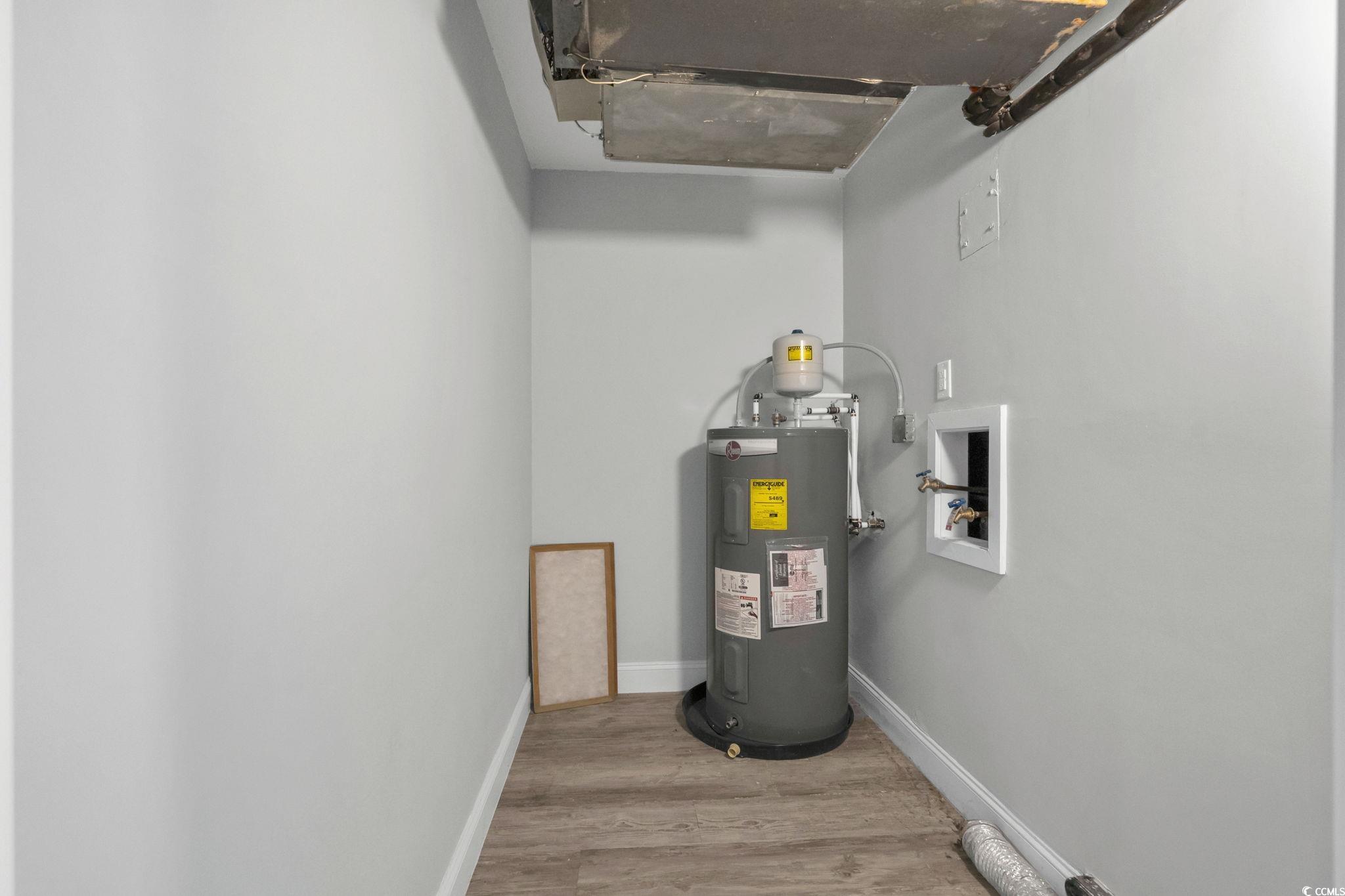 601 Mitchell Drive, Unit 207 Myrtle Beach, SC 29577 - Photo 21 of 38 Utility room featuring electric water heater