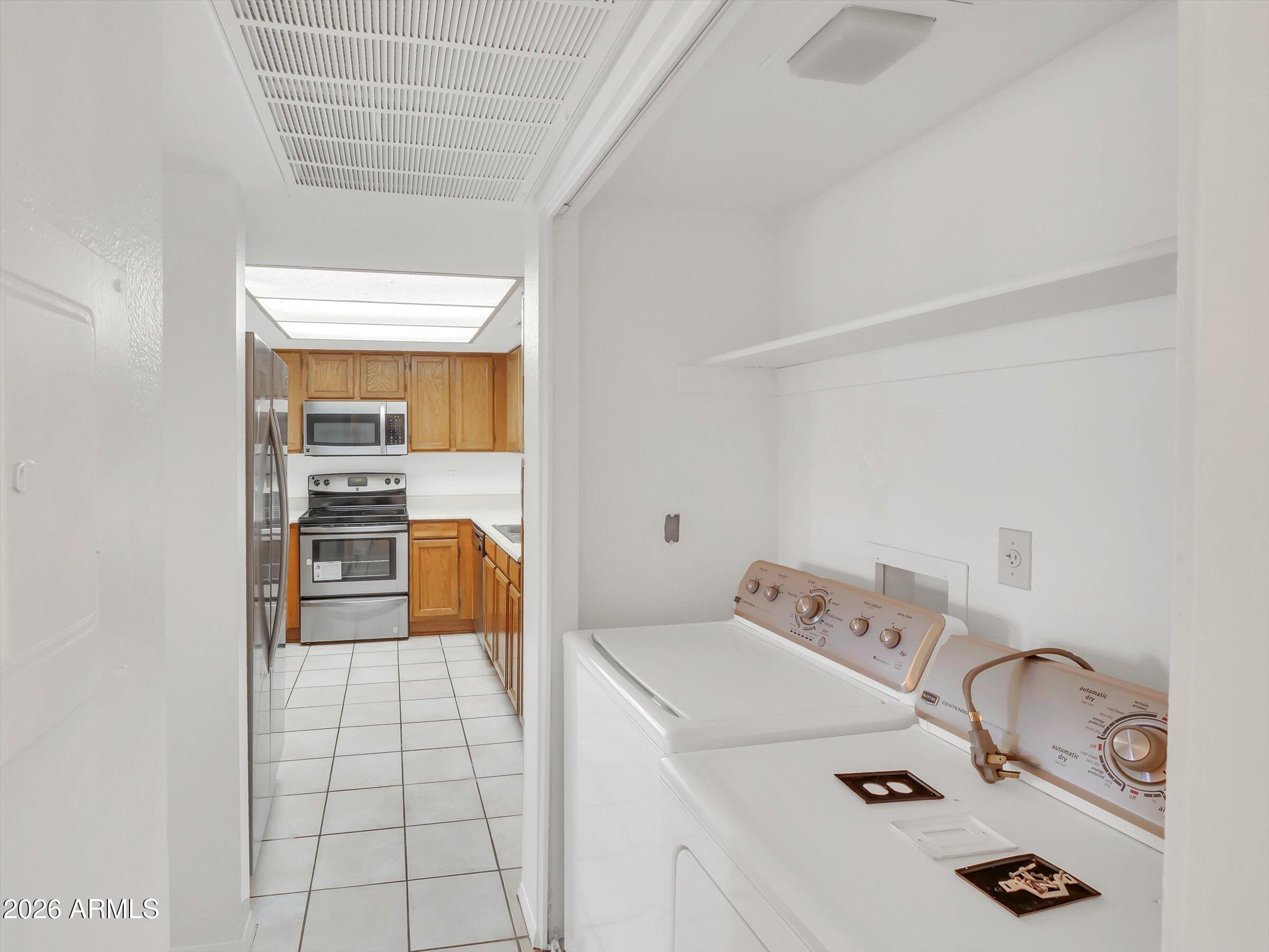 1645 West Baseline Road, Unit 2072 Mesa, AZ 85202 - Photo 15 of 37 a bedroom with a bed and a dresser