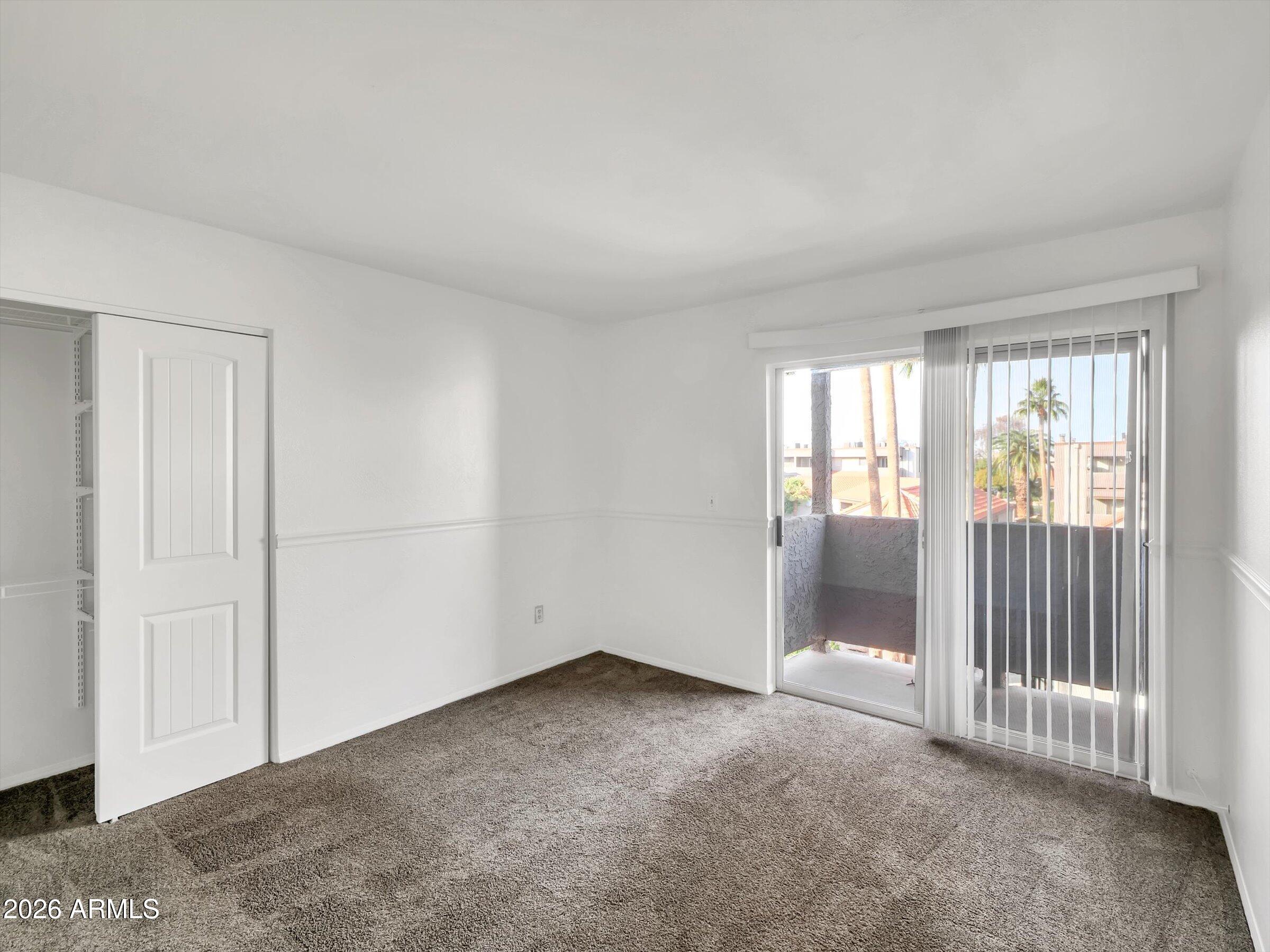 1645 West Baseline Road, Unit 2072 Mesa, AZ 85202 - Photo 20 of 37 a view of an empty room with a window