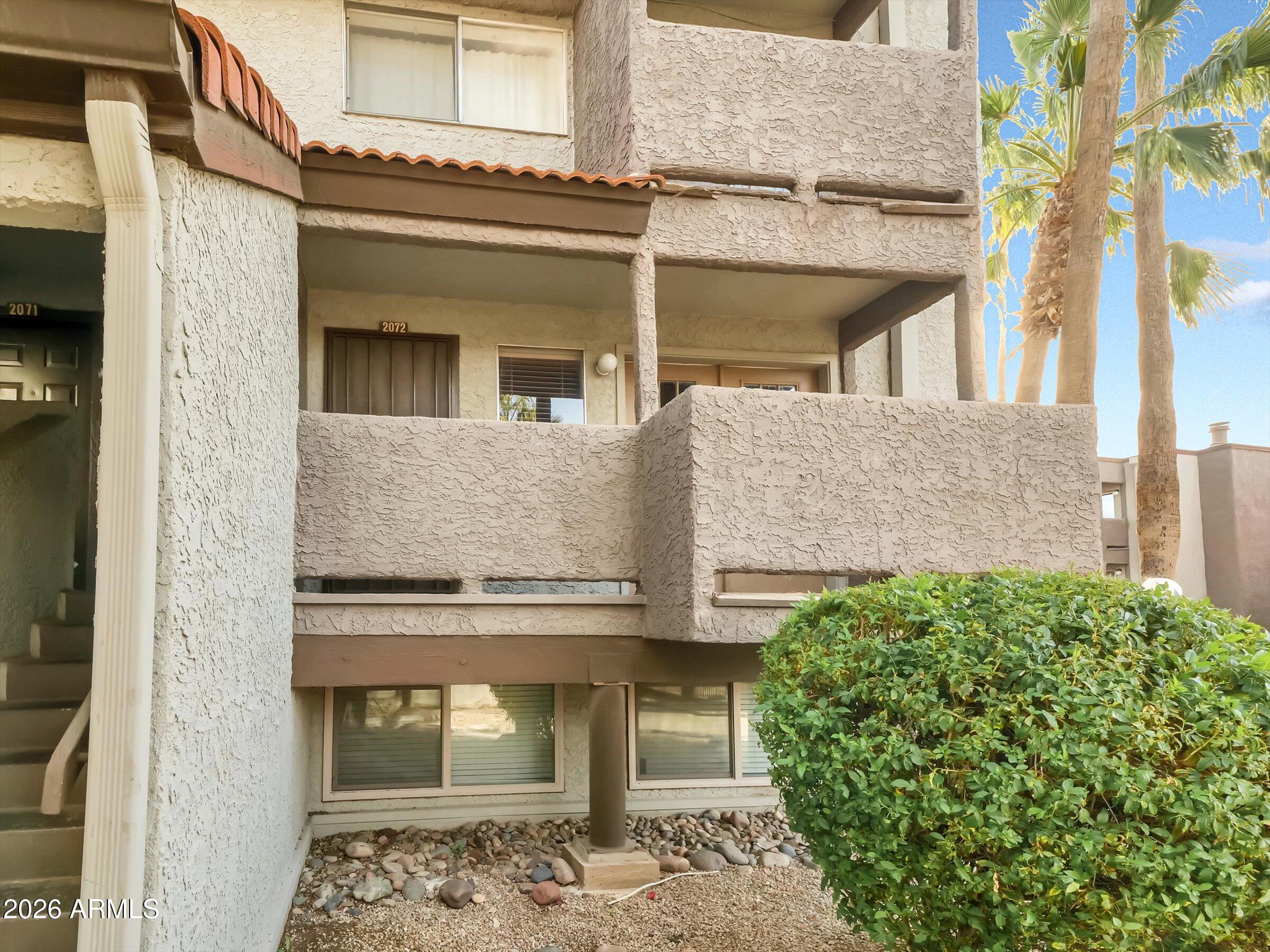 1645 West Baseline Road, Unit 2072 Mesa, AZ 85202 - Photo 2 of 37 front view of a house with a potted plant