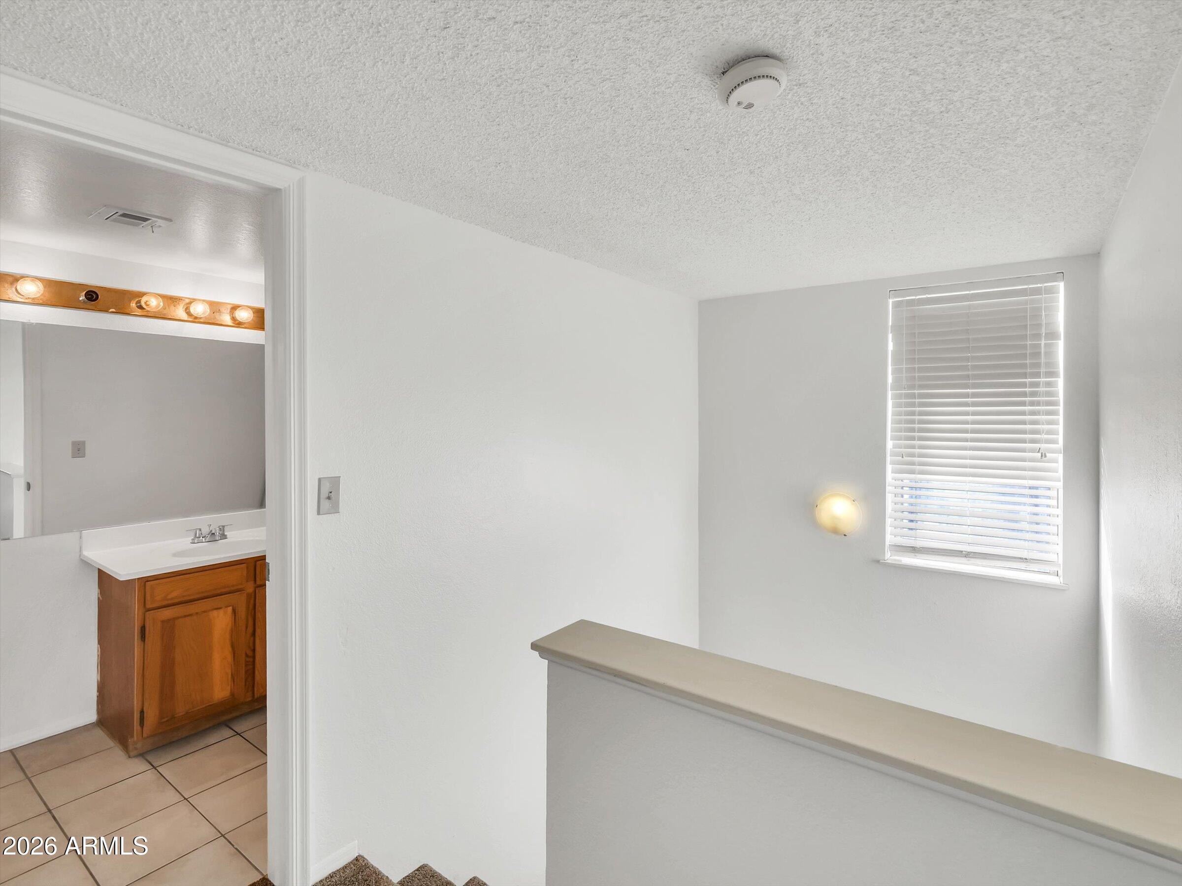 1645 West Baseline Road, Unit 2072 Mesa, AZ 85202 - Photo 23 of 37 a view of a kitchen cabinets and a window