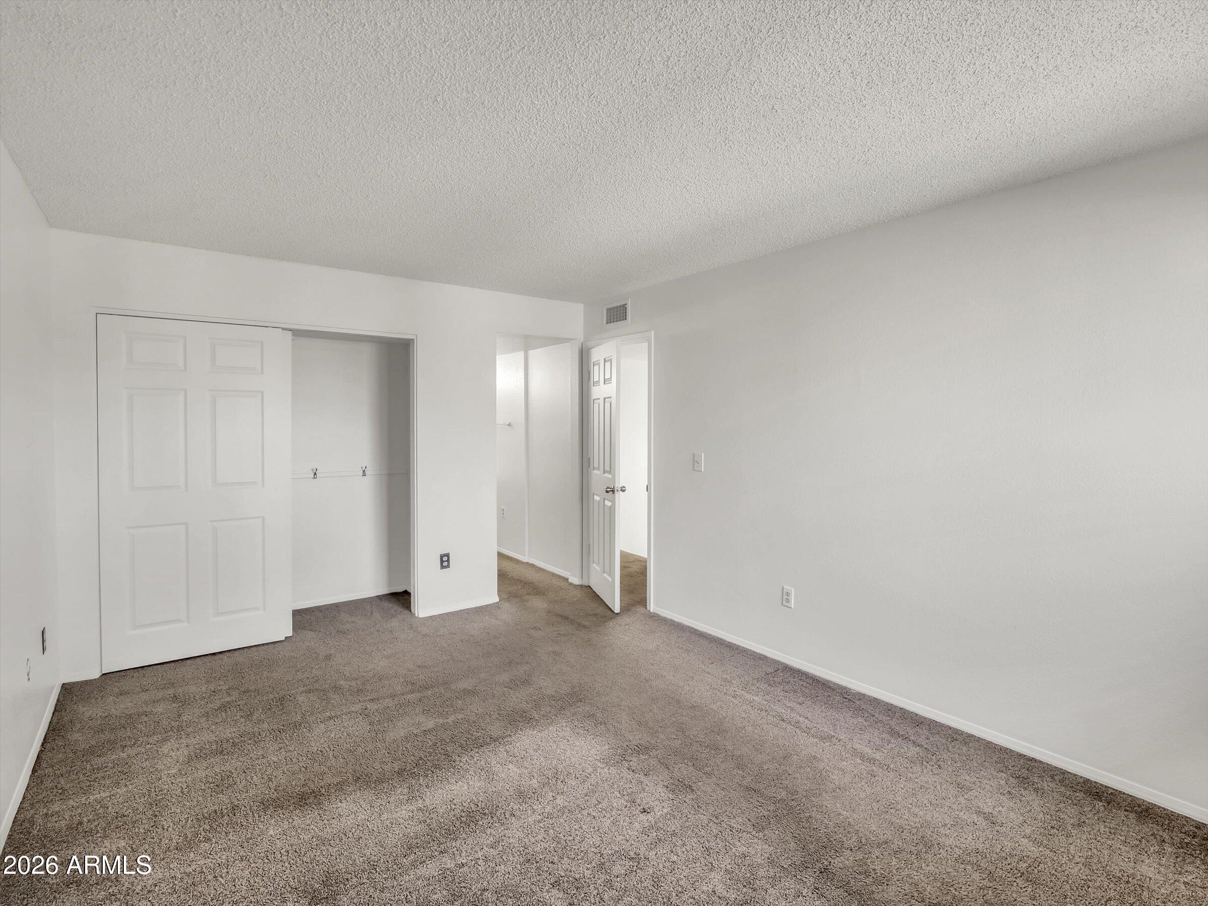 1645 West Baseline Road, Unit 2072 Mesa, AZ 85202 - Photo 29 of 37 a view of an empty room and natural light