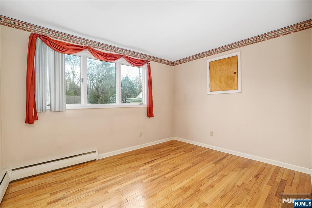 31 Collins Avenue Closter, NJ 07624 - Photo 12 of 37 a view of empty room with wooden floor and fan