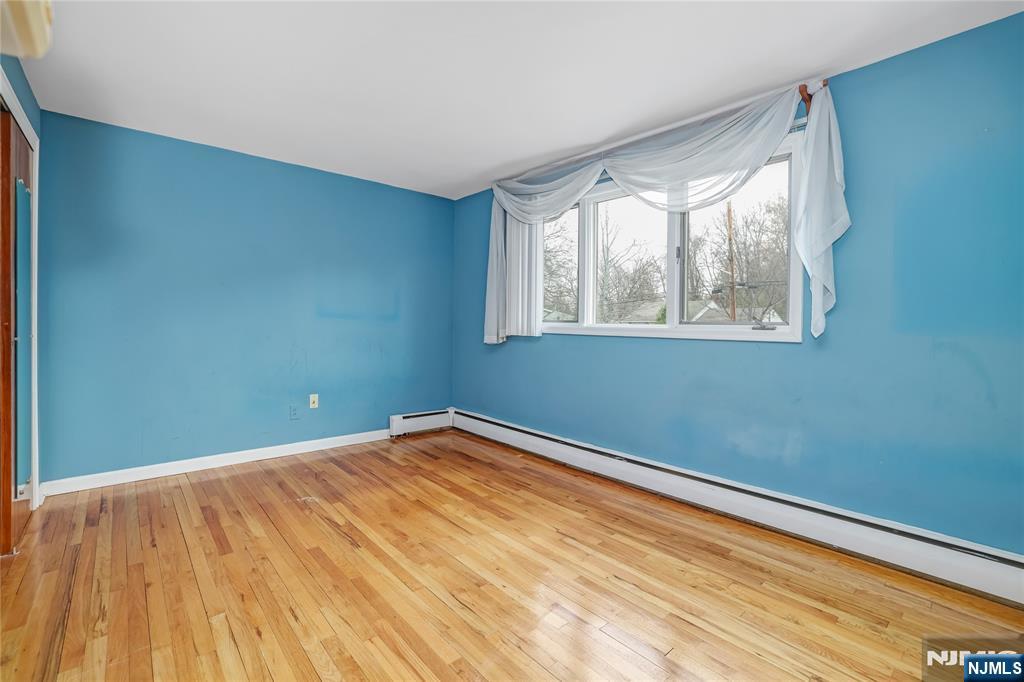 31 Collins Avenue Closter, NJ 07624 - Photo 13 of 37 a view of empty room with wooden floor and fan