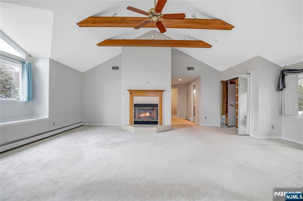 31 Collins Avenue Closter, NJ 07624 - Photo 17 of 37 an empty room with ceiling fan and window