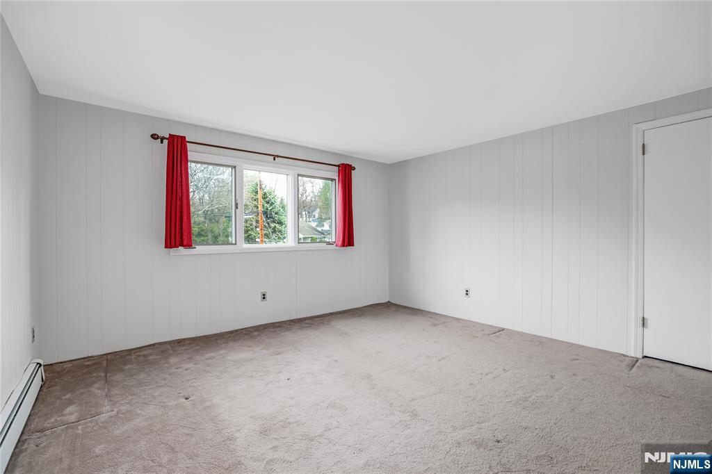 31 Collins Avenue Closter, NJ 07624 - Photo 20 of 37 a view of an empty room with a window