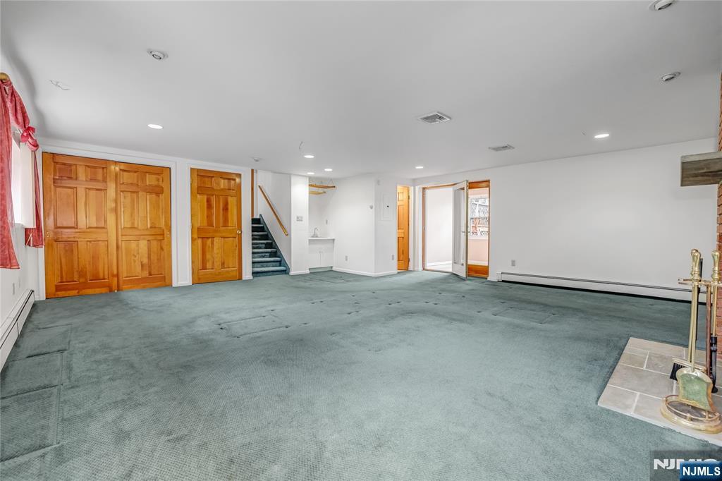 31 Collins Avenue Closter, NJ 07624 - Photo 24 of 37 a view of an empty room with a window