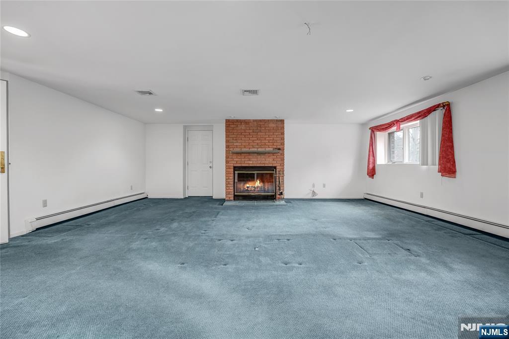 31 Collins Avenue Closter, NJ 07624 - Photo 25 of 37 a view of an empty room with fireplace