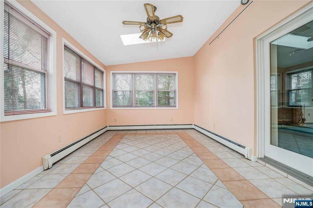 31 Collins Avenue Closter, NJ 07624 - Photo 27 of 37 a view of an empty room and window