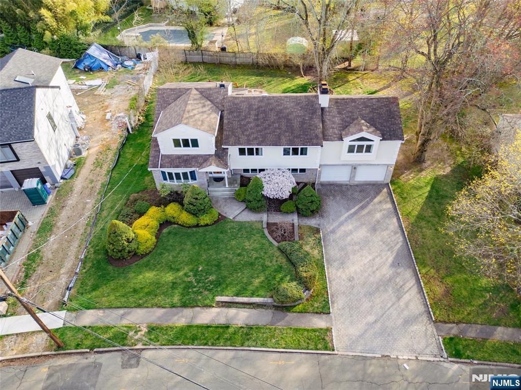 31 Collins Avenue Closter, NJ 07624 - Photo 32 of 37 an aerial view of a house with garden space and street view