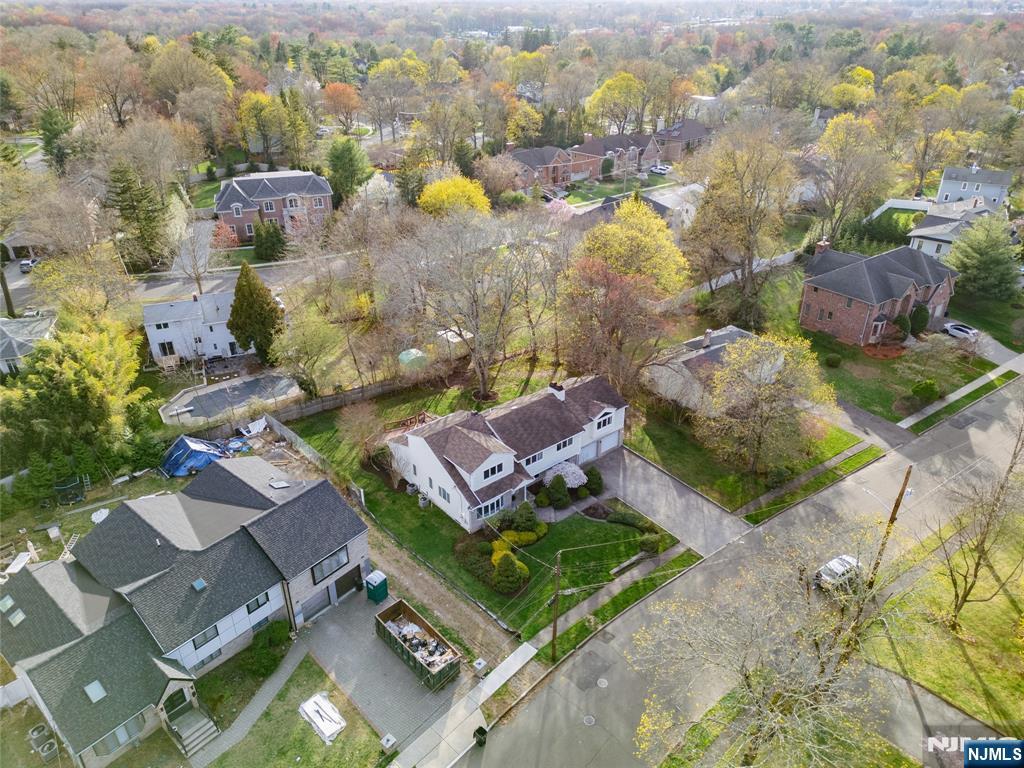 31 Collins Avenue Closter, NJ 07624 - Photo 34 of 37 an aerial view of a house with a swimming pool