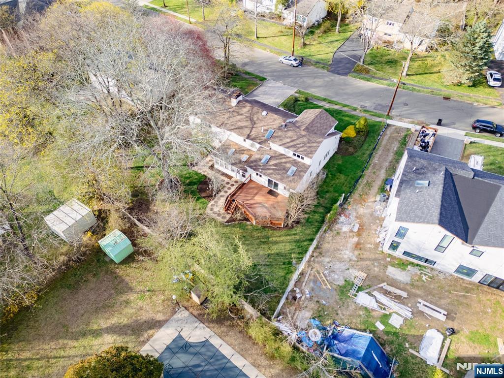 31 Collins Avenue Closter, NJ 07624 - Photo 36 of 37 a backyard of a house with lots of green space