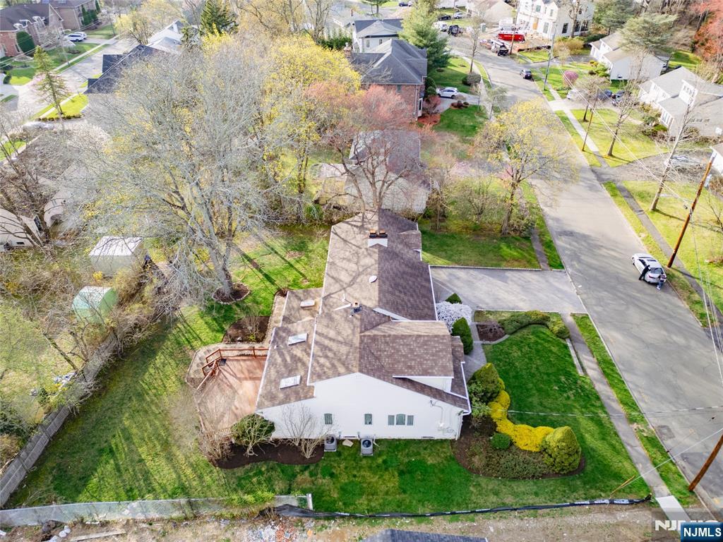 31 Collins Avenue Closter, NJ 07624 - Photo 37 of 37 an aerial view of a house with a yard and garden