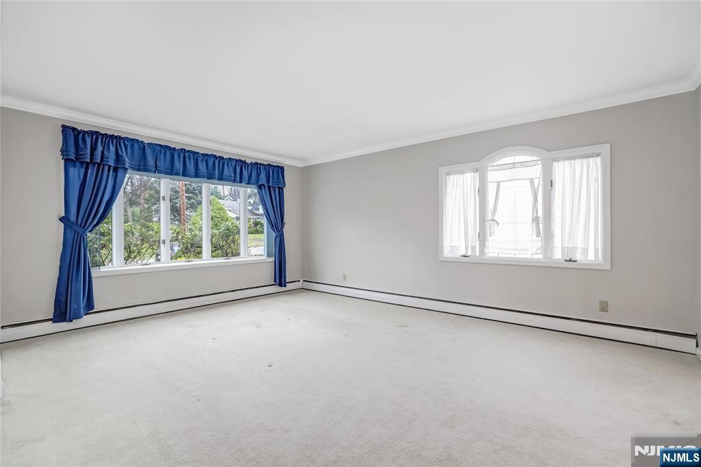 31 Collins Avenue Closter, NJ 07624 - Photo 4 of 37 an empty room with windows