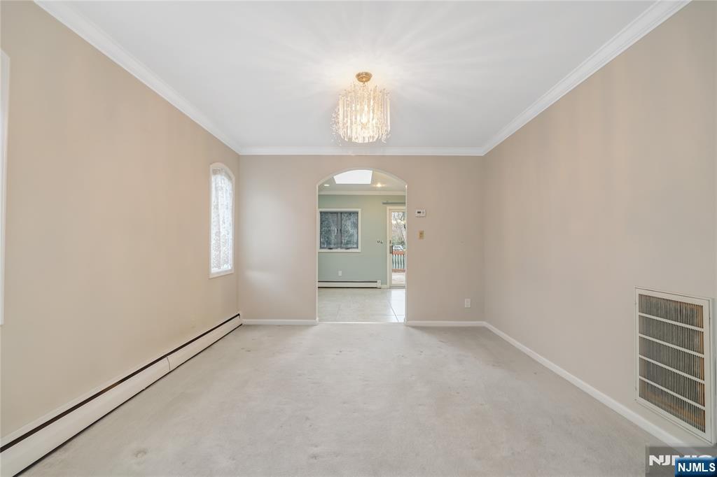 31 Collins Avenue Closter, NJ 07624 - Photo 5 of 37 a view of an empty room with a window