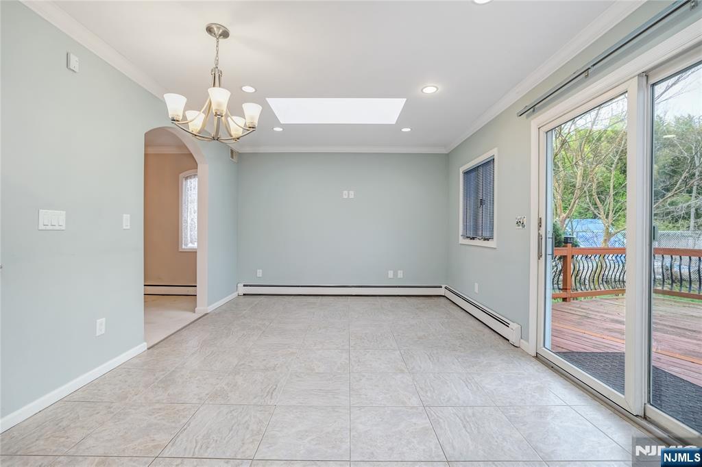 31 Collins Avenue Closter, NJ 07624 - Photo 8 of 37 a view of an empty room with a window