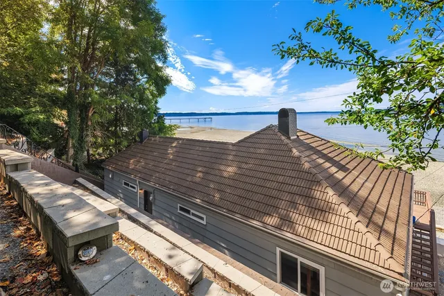 a view of a backyard with sitting area
