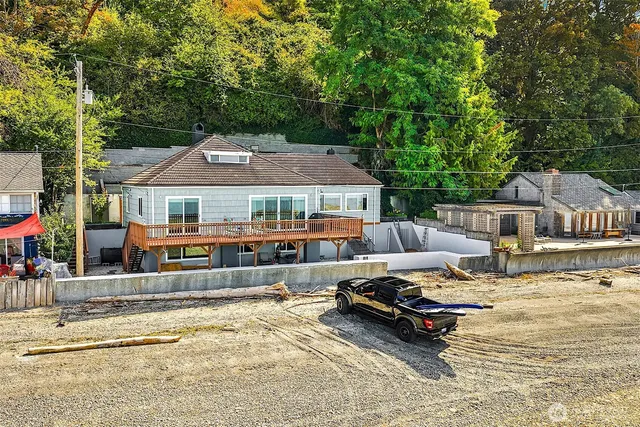 a swimming pool with outdoor seating and yard