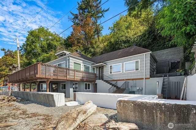 a front view of a house with a yard covered with snow in the outdoor space