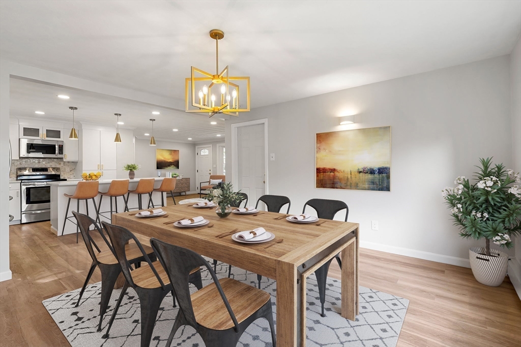 21 Savoy Road Framingham, MA 01701 - Photo 14 of 37 a view of a dining room with furniture and wooden floor