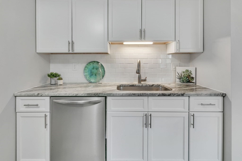 284 Ambrose Street Springfield, MA 01109 - Photo 12 of 29 a kitchen with stainless steel appliances granite countertop white cabinets and a sink