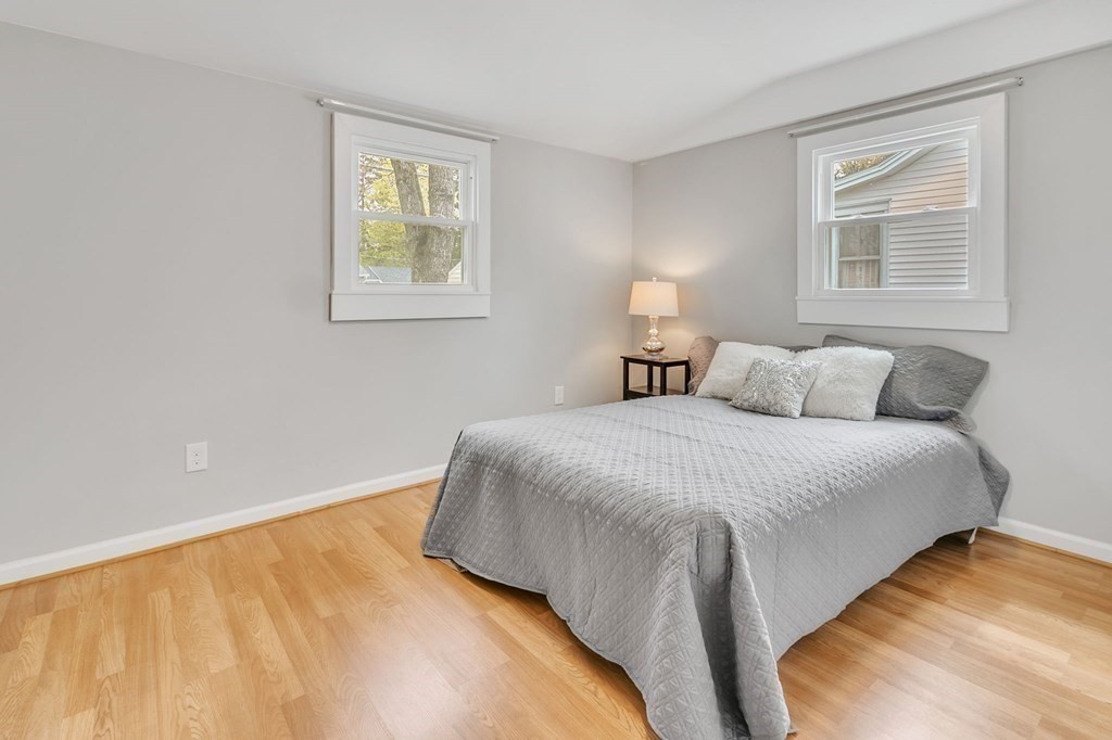 284 Ambrose Street Springfield, MA 01109 - Photo 19 of 29 a bedroom with a bed and painting on the wall