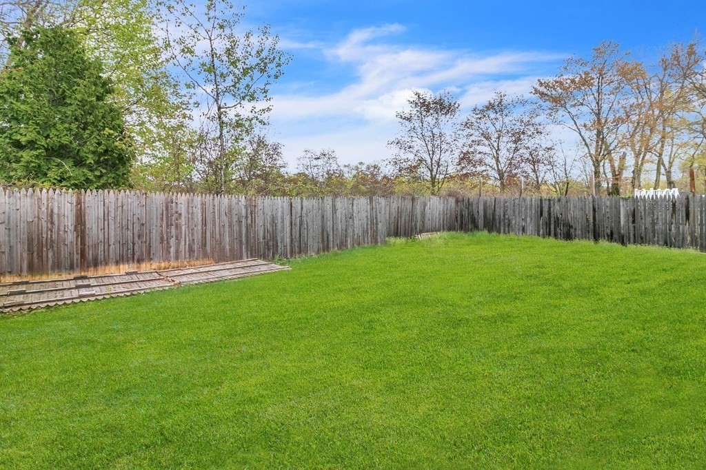 284 Ambrose Street Springfield, MA 01109 - Photo 29 of 29 a view of a backyard with wooden fence