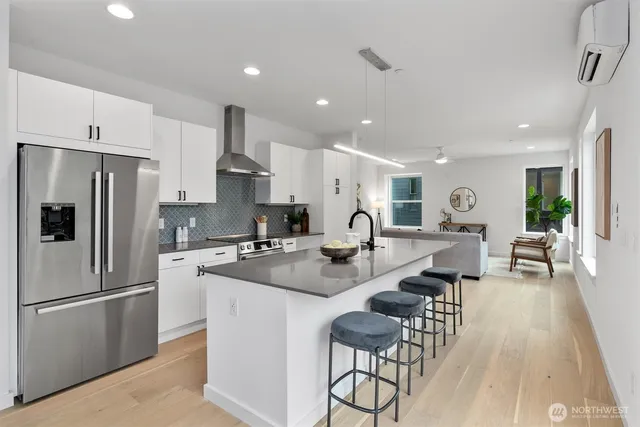 a kitchen with counter top space cabinets and stainless steel appliances