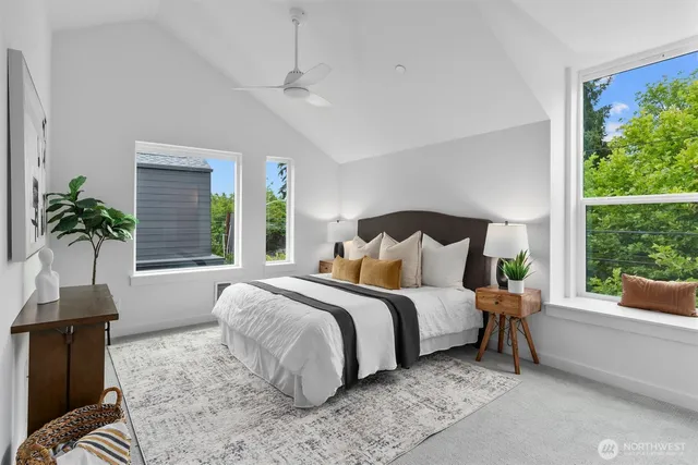 a bed sitting in a bedroom next to a window