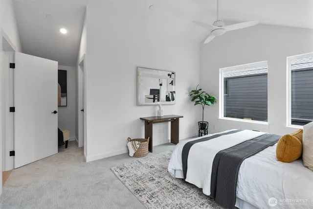 a bedroom with a bed and a table