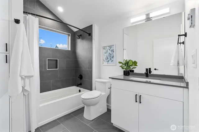 a white bath tub sitting next to a white sink