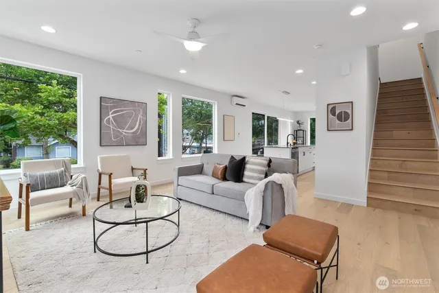 a living room with furniture and a large window
