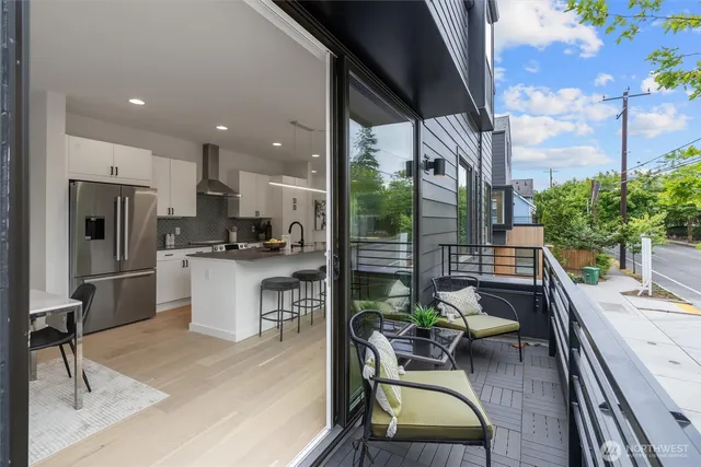 a kitchen with a table chairs refrigerator and stove