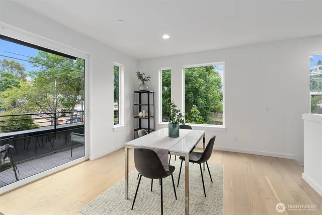 a view of a dining room with furniture window and outside view