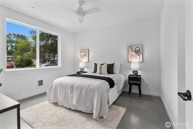 a bedroom with a bed and a window