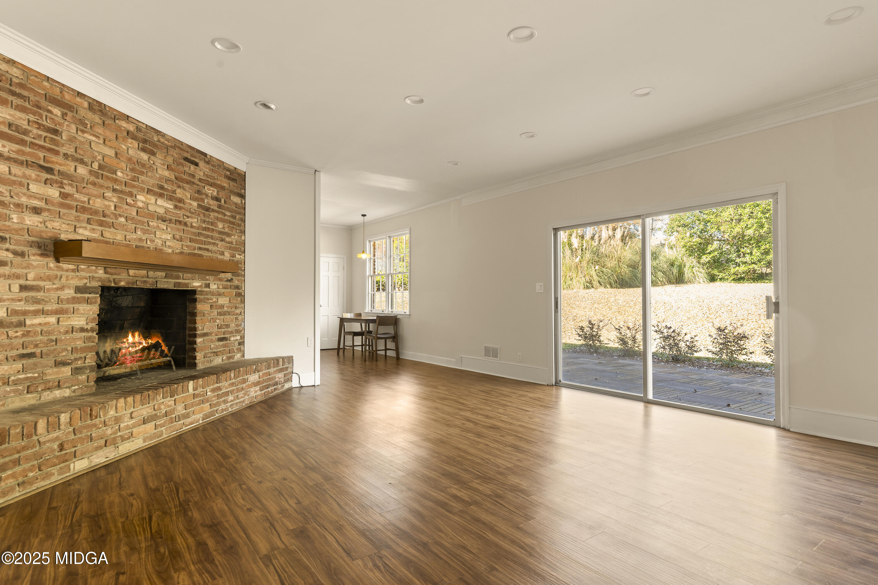 620 Rosa Taylor Drive Macon, GA 31204 - Photo 24 of 45 wooden floor fireplace and windows in an empty room