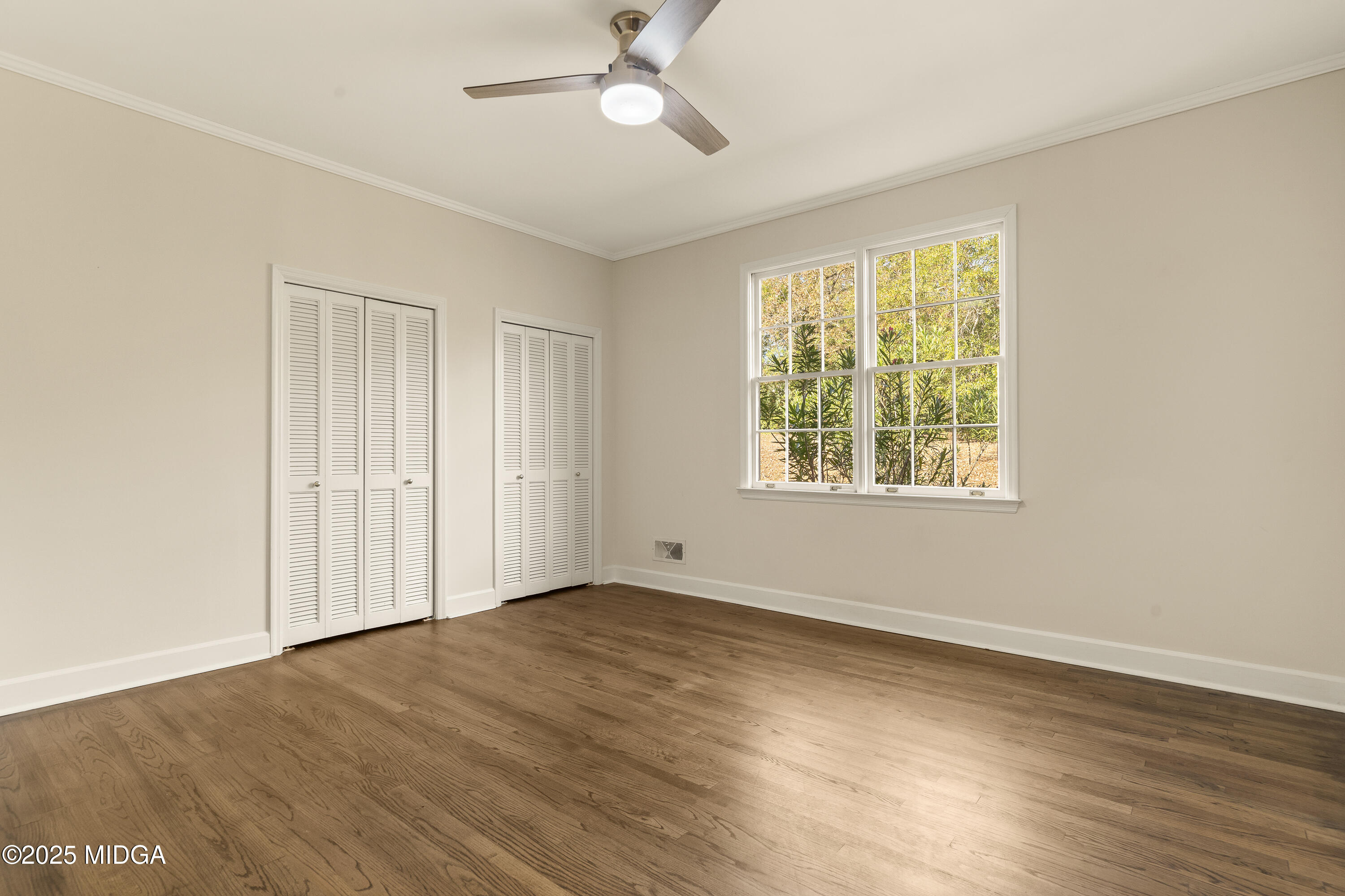 620 Rosa Taylor Drive Macon, GA 31204 - Photo 26 of 45 a view of an empty room with wooden floor and a window