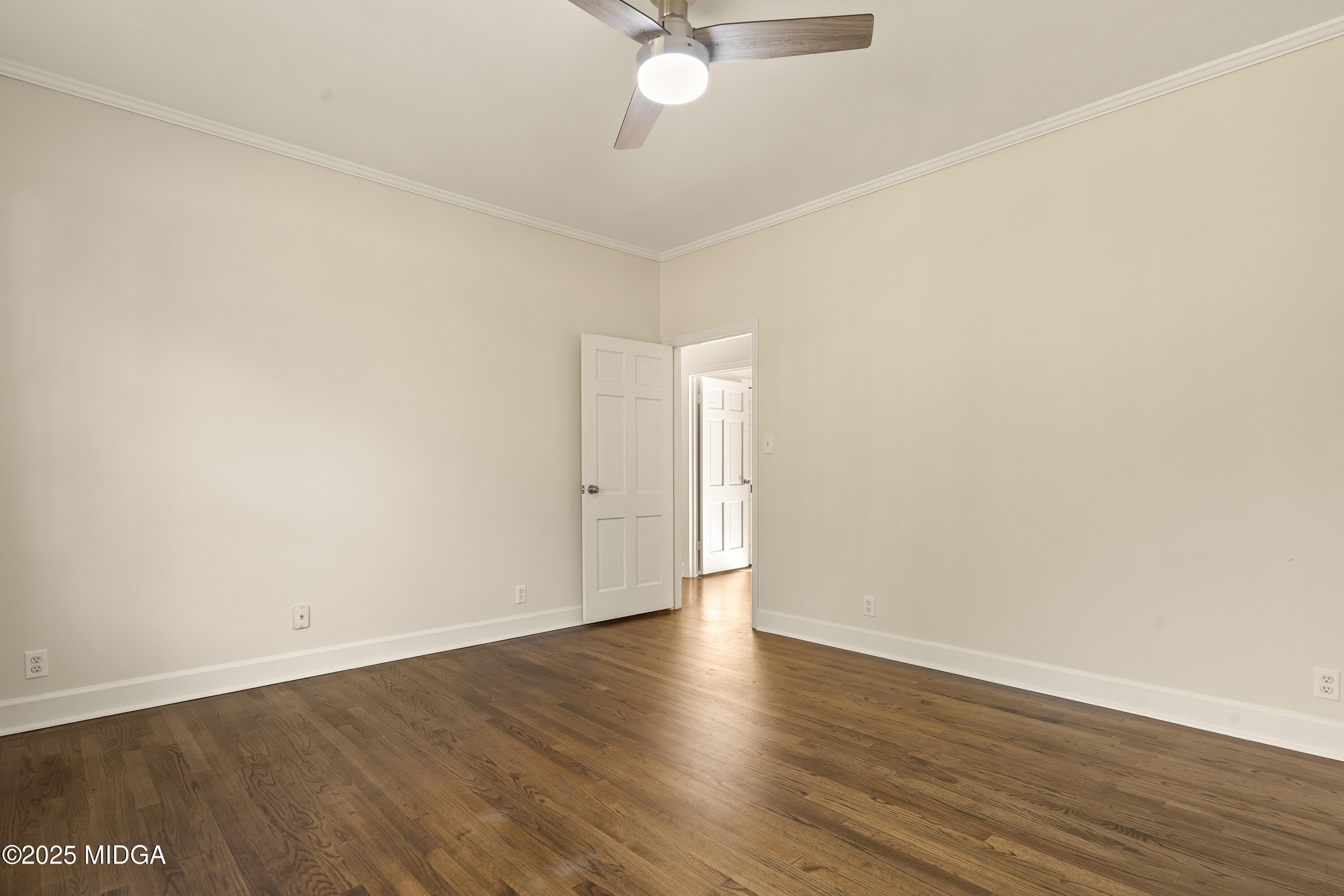 620 Rosa Taylor Drive Macon, GA 31204 - Photo 27 of 45 an empty room with wooden floor and fan
