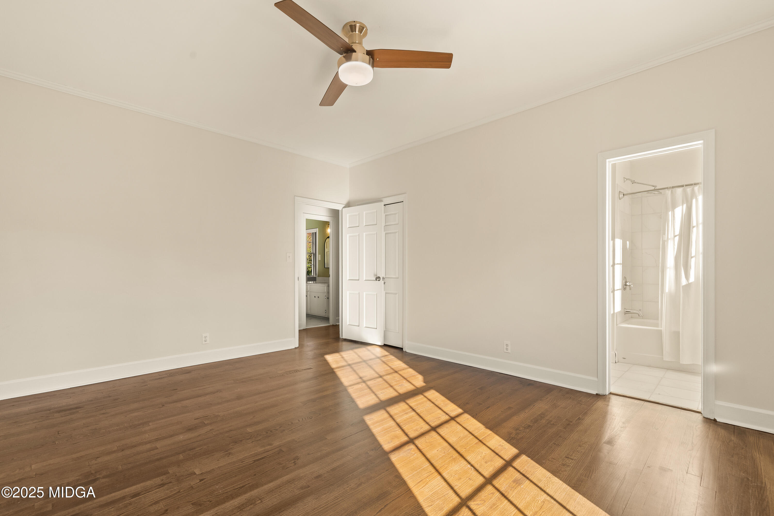 620 Rosa Taylor Drive Macon, GA 31204 - Photo 29 of 45 an empty room with wooden floor cabinet and windows