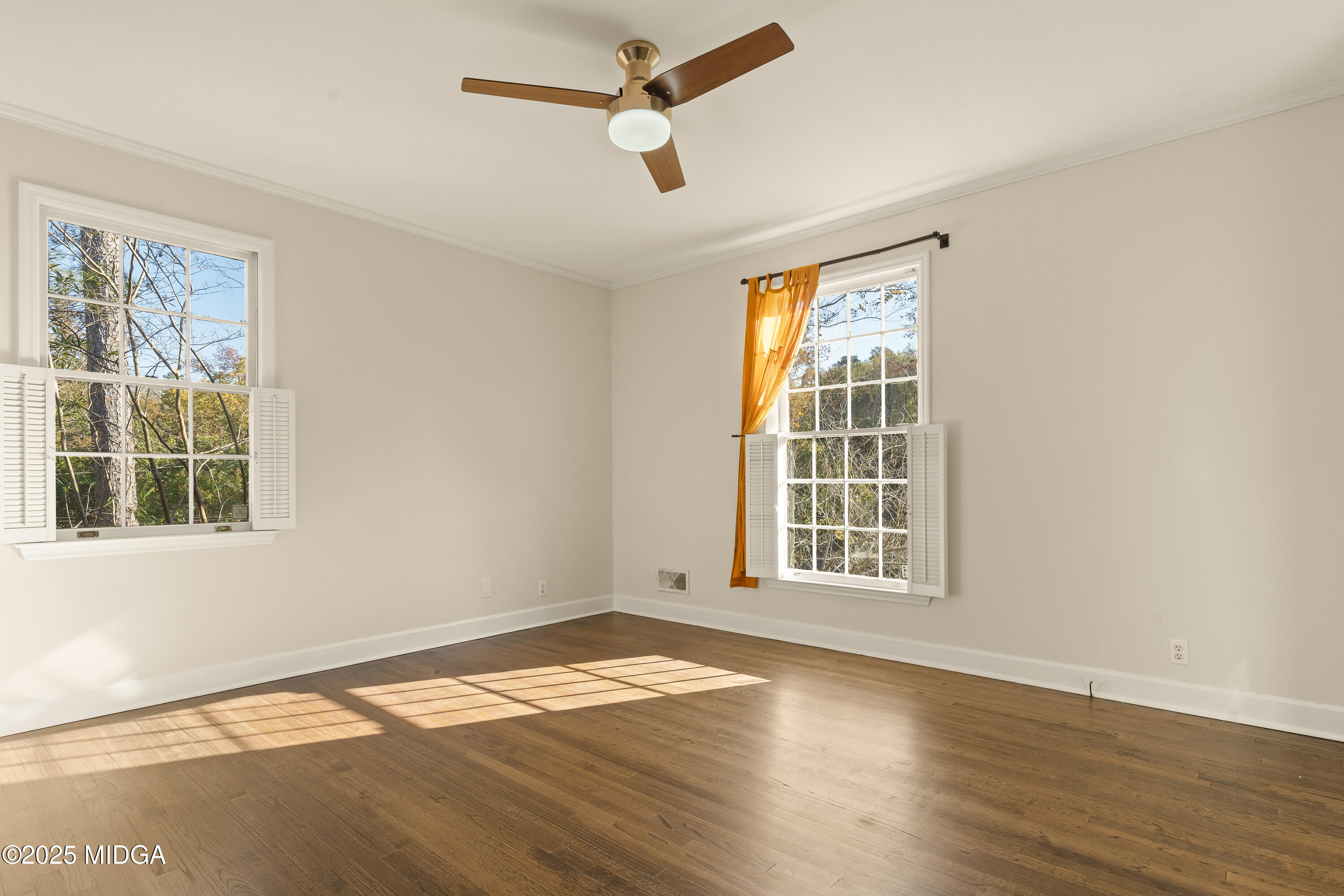 620 Rosa Taylor Drive Macon, GA 31204 - Photo 33 of 45 a view of an empty room with wooden floor and a window
