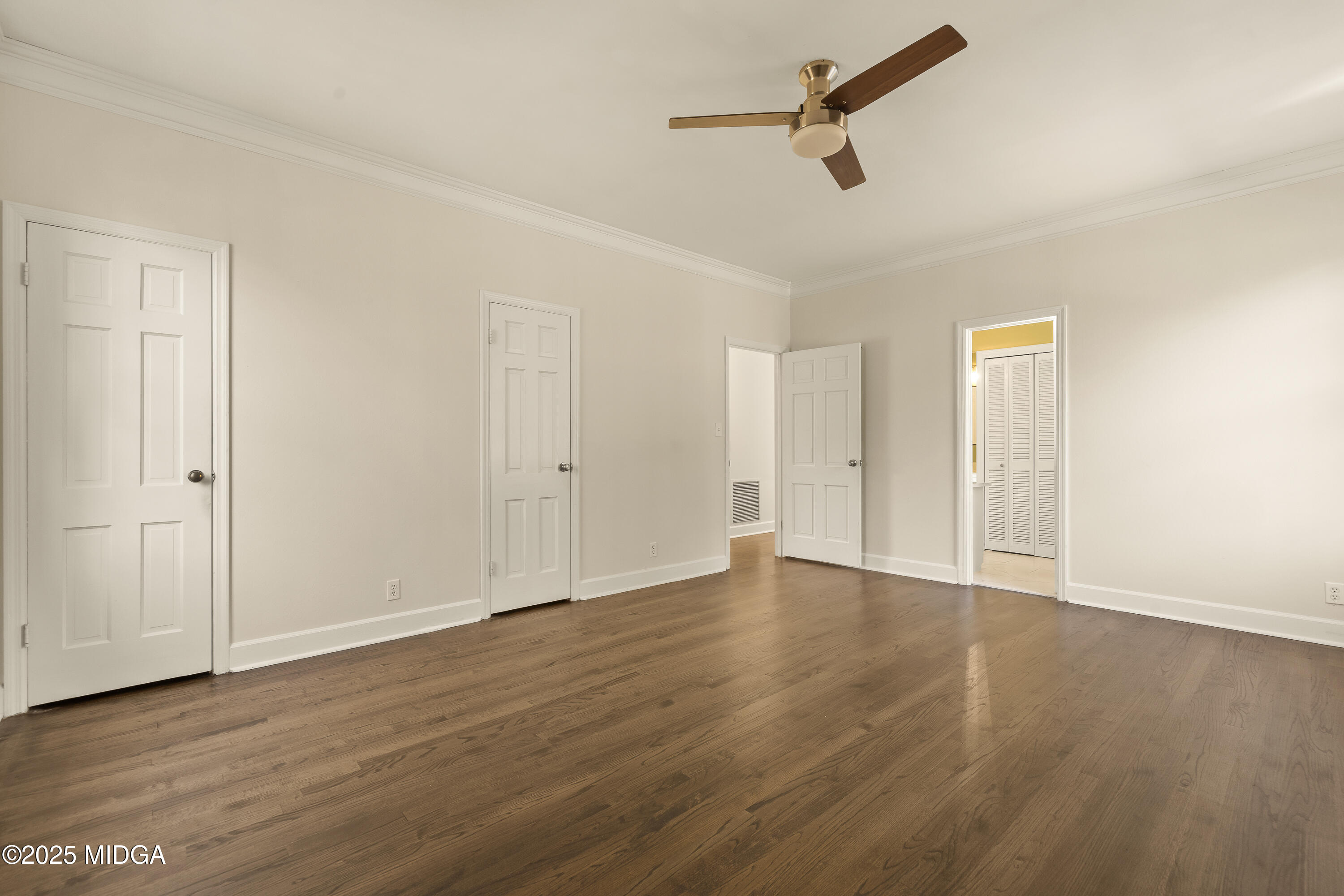 620 Rosa Taylor Drive Macon, GA 31204 - Photo 36 of 45 an empty room with wooden floor ceiling fan