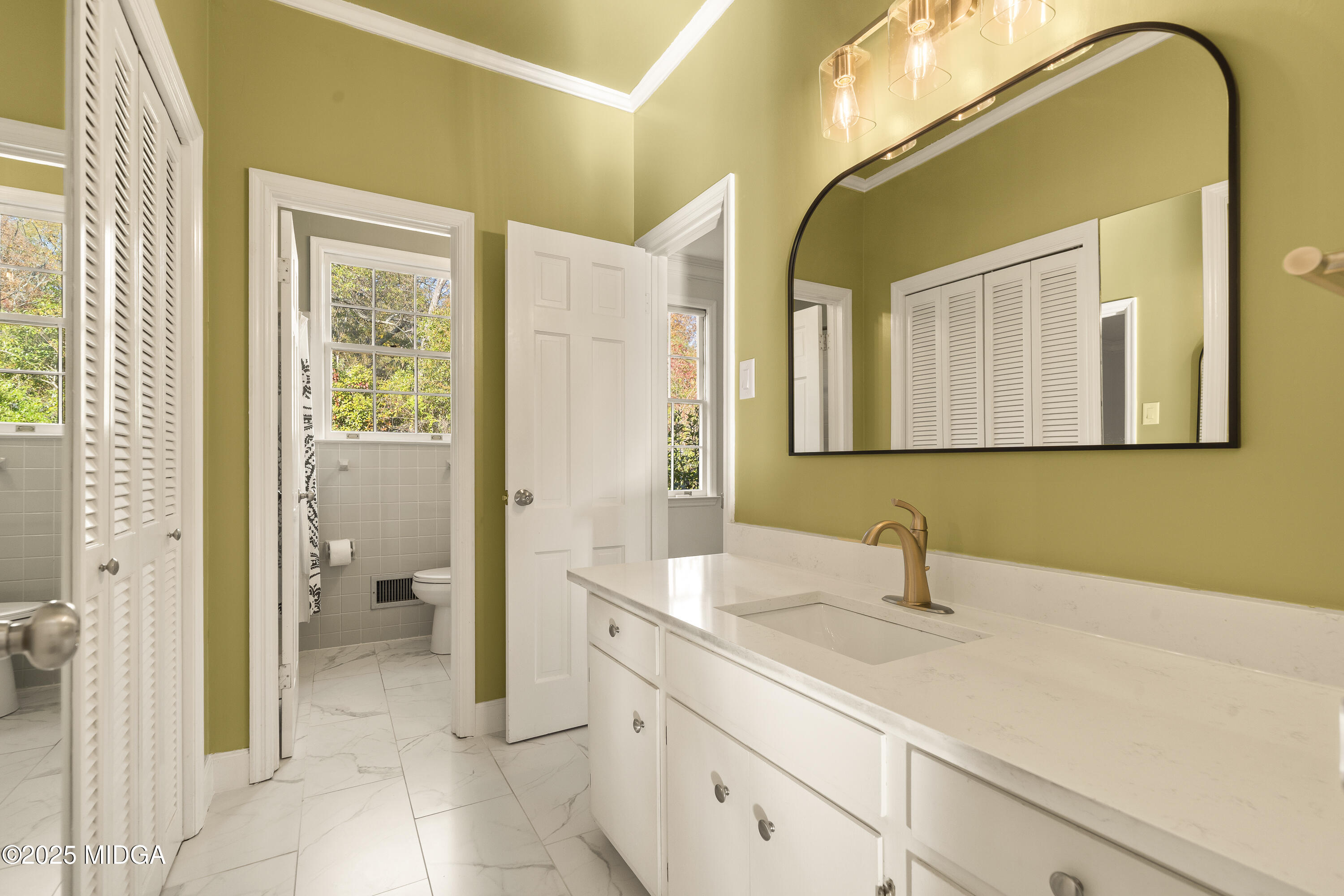 620 Rosa Taylor Drive Macon, GA 31204 - Photo 38 of 45 a spacious bathroom with a sink and a mirror