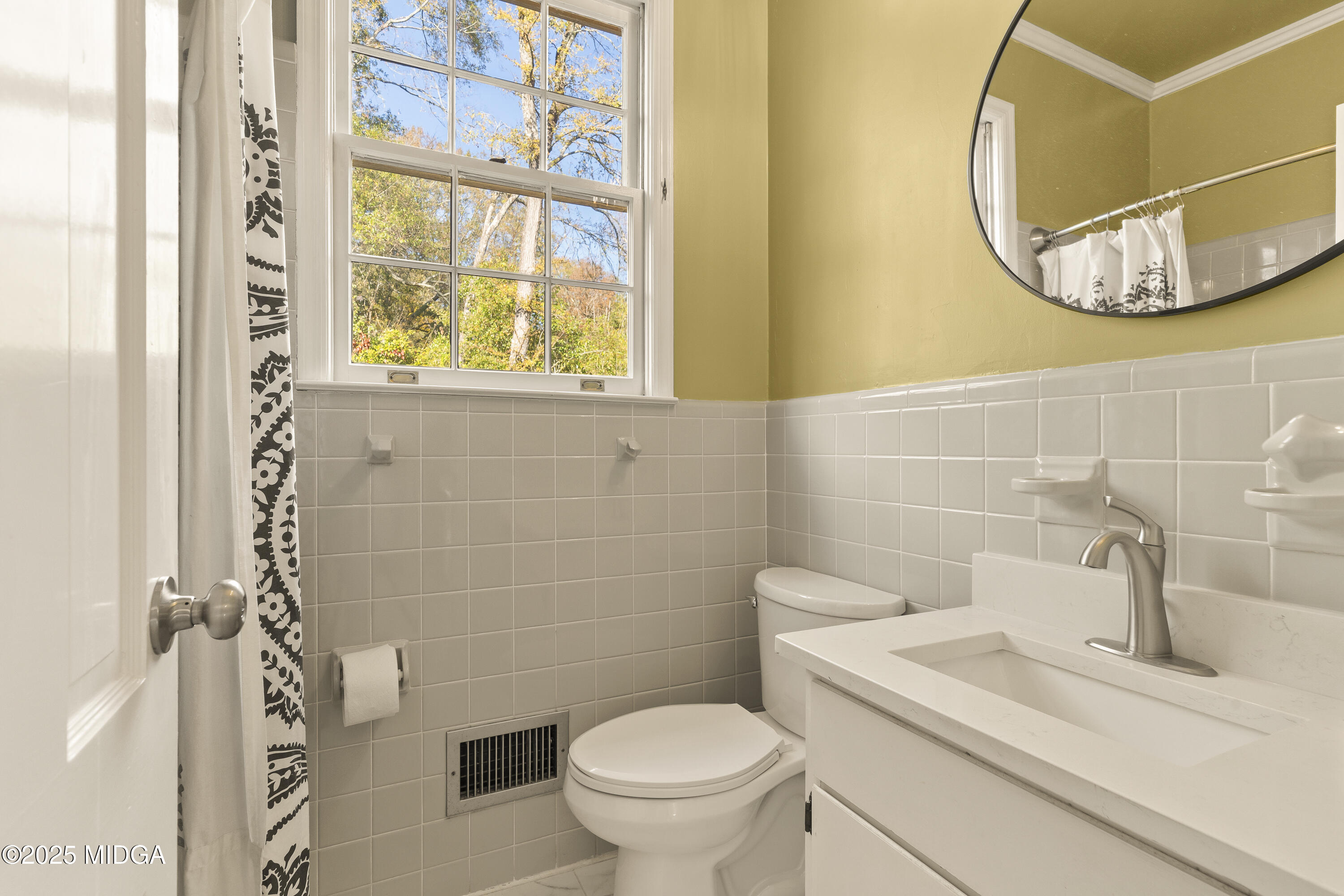 620 Rosa Taylor Drive Macon, GA 31204 - Photo 39 of 45 a bathroom with a sink and a mirror