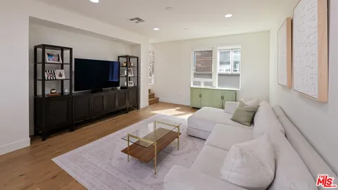 a bedroom with a bed and a table