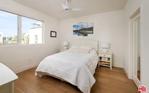a bathroom with a granite countertop sink a shower and a mirror
