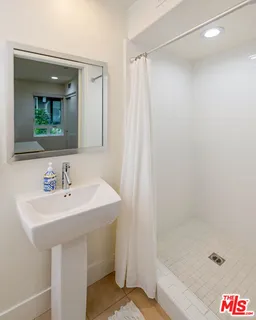 a roof deck with table and chairs