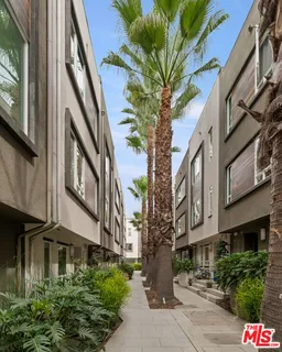 a front view of a building with parking